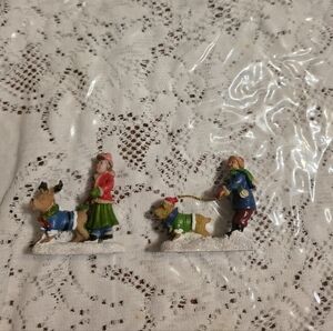 Festive Winter Children and Dogs Figurine Set